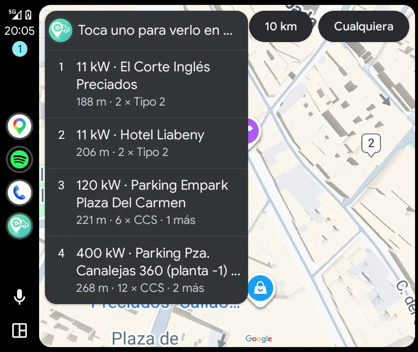 CargaLive on Android Auto: the list of nearby chargers in central Madrid with their power, distance and connectors, the map with the chargers numbered, and the radius and power buttons at the top